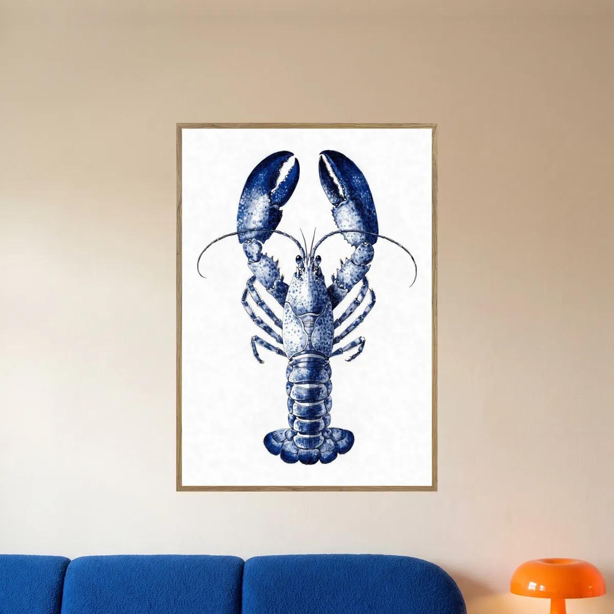 The blue lobster print in an oak frame above a blue sofa