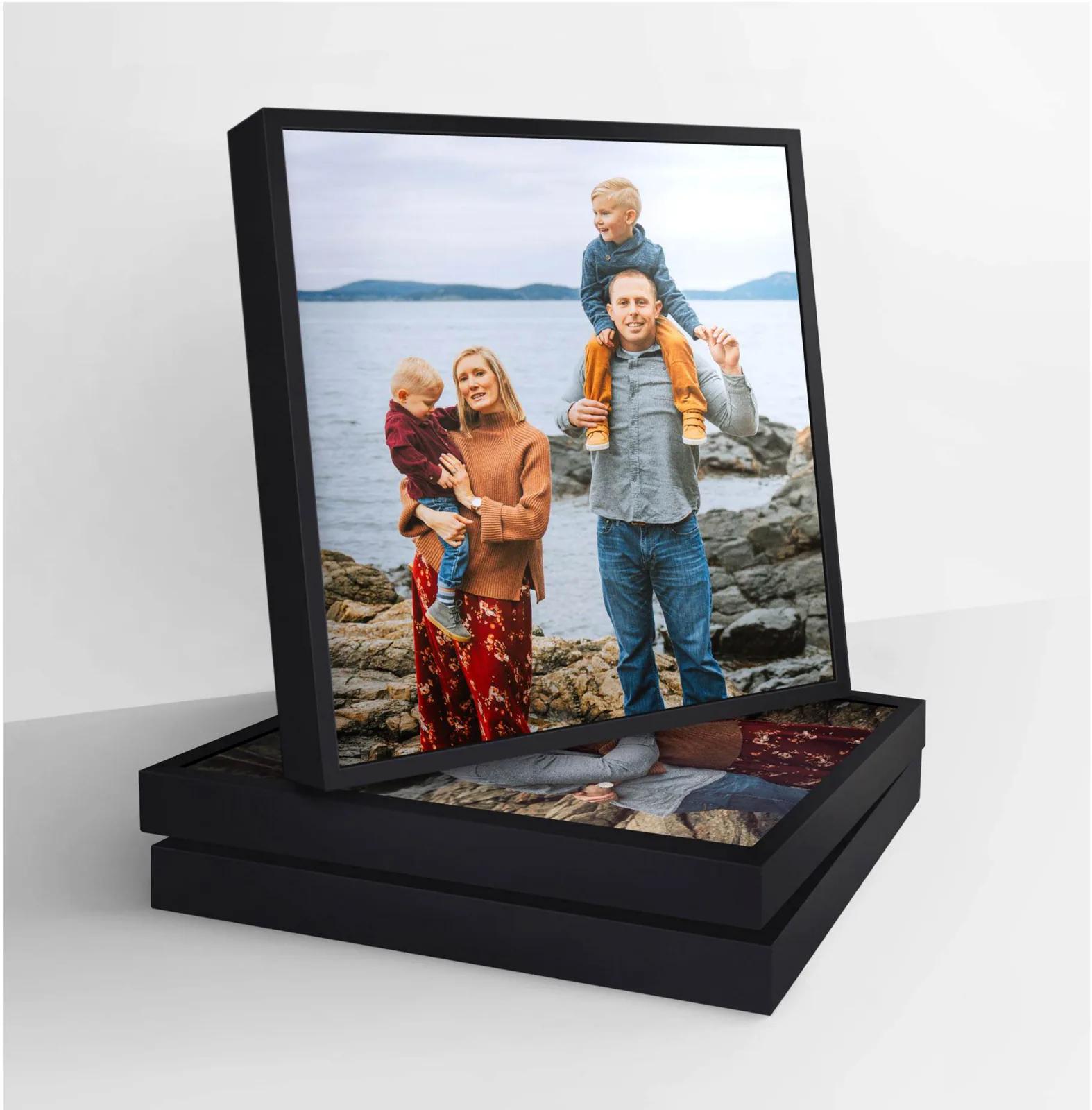 Photo tile finished with a plastic frame
