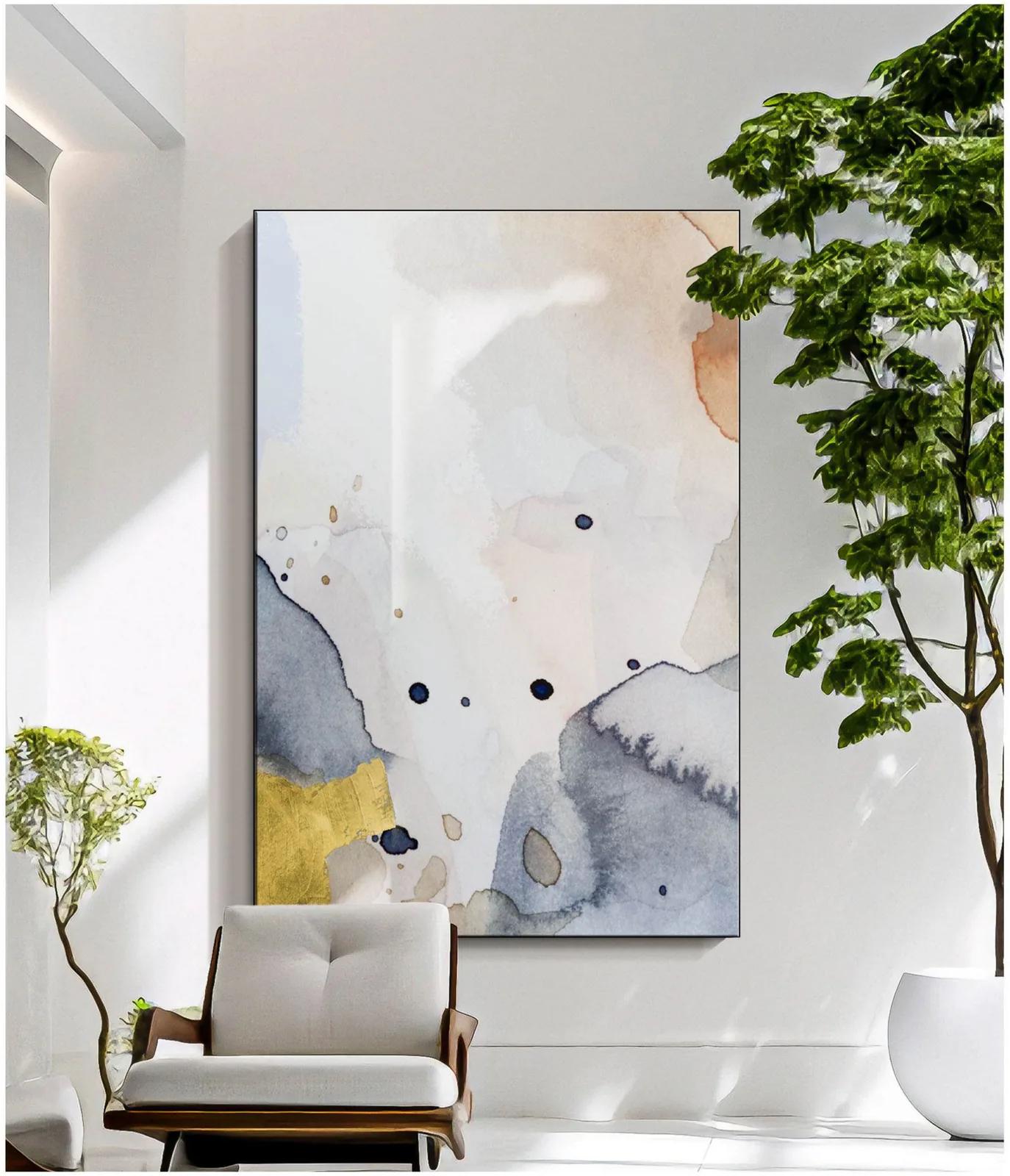 Oversized textile wall art hung in a living room
